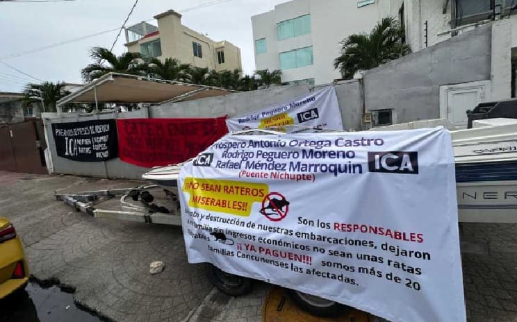 Cancun boatmen demanding payment for transportation services provided to lagoon bridge construction workers