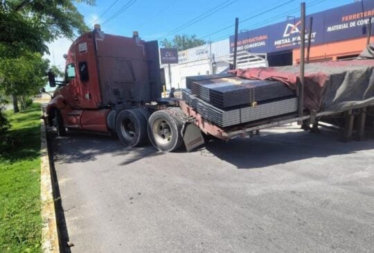 Semi bed loaded with steel breaks free blocking busy avenue