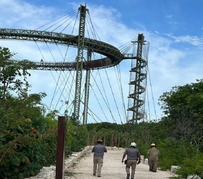 Emergency personnel talk tourist down from top of Parque El Jaguar structure