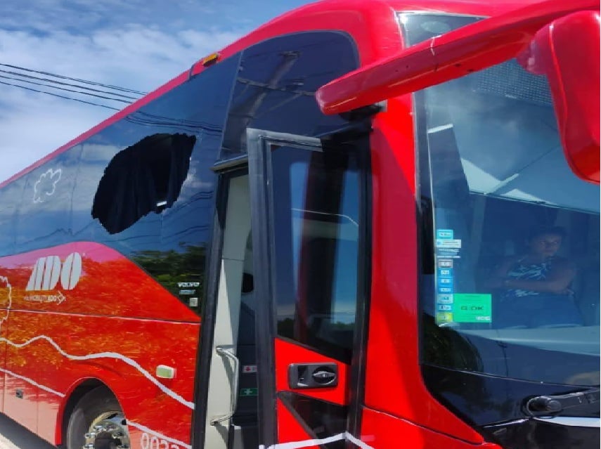 PDC bus passengers delayed by flying brick from passing semi