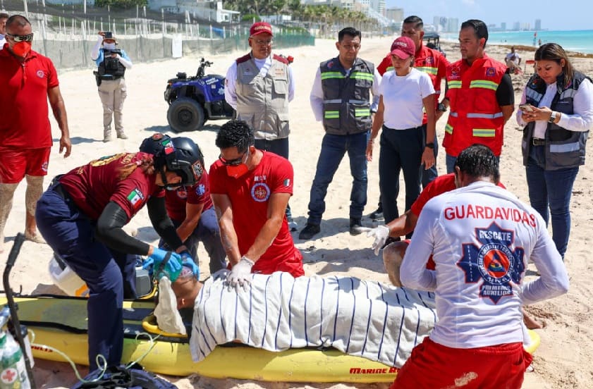Cancun lifeguards practice water rescue drills on city beach