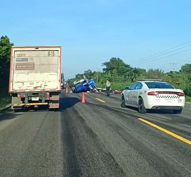 Driver flips cargo truck transporting load of steel