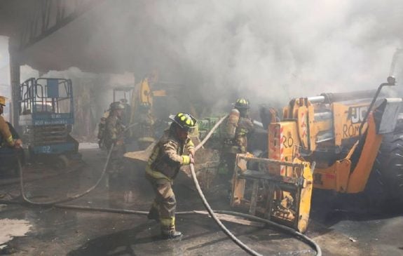 City firefighters save burning warehouse filled with heavy equipment
