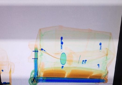 Passenger heading for Havana arrested inside Cancun International after X-ray reveals false bottom