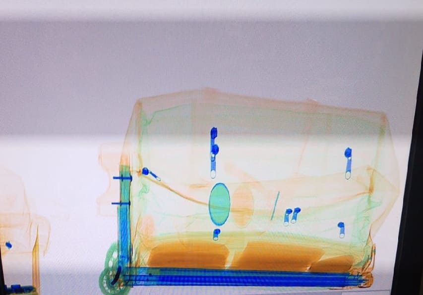 Passenger heading for Havana arrested inside Cancun International after X-ray reveals false bottom