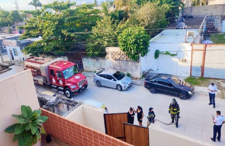 Firemen attend to mattress fire in third floor apartment