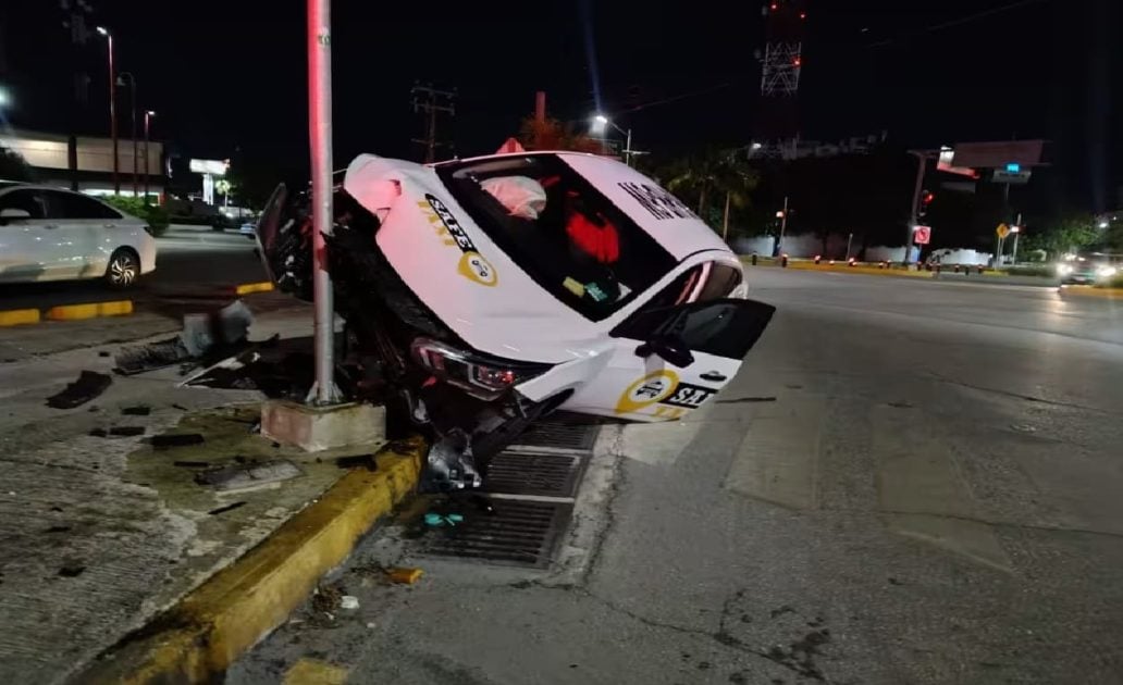 Erratic driving lands Cancun Safe Taxi on top of concrete posts