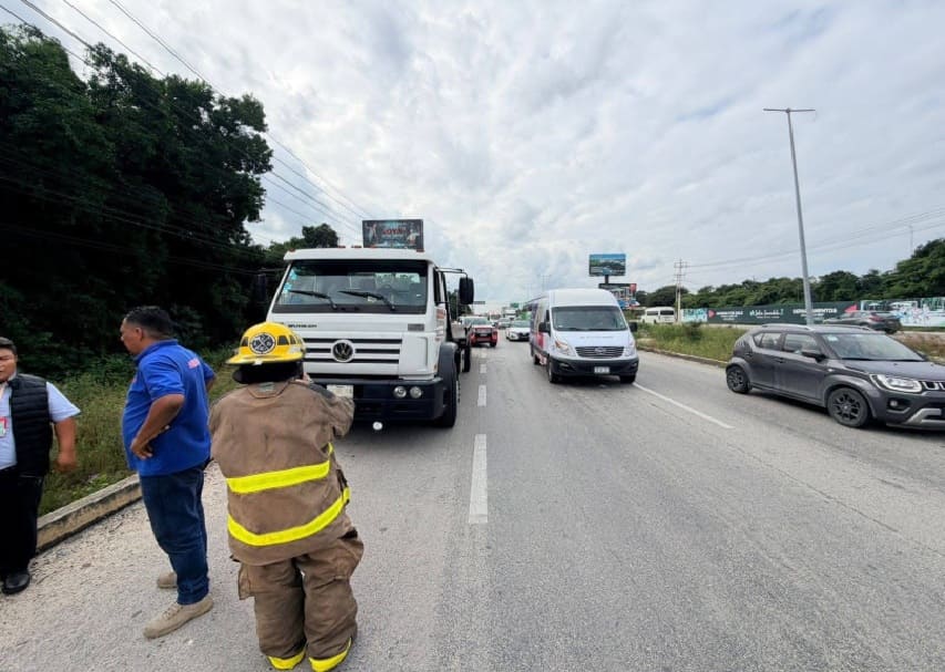 Dozing driver flips passenger bus hampering Cancun highway traffic
