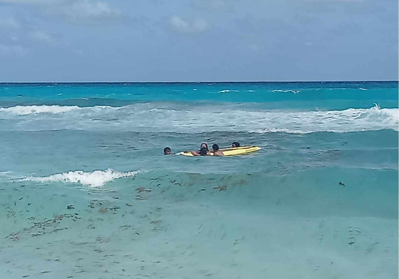 Cancun lifeguards rescue three swept out by strong rip currents despite ...
